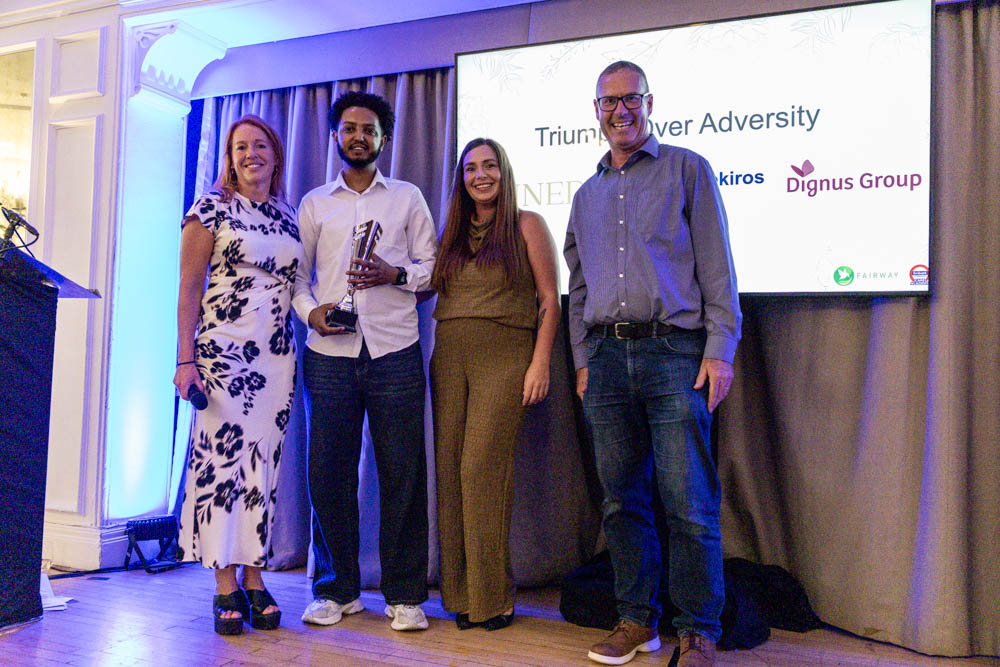 Bereket Woldekiros from Chance Drive receiving the Triumph Over Adversity Award